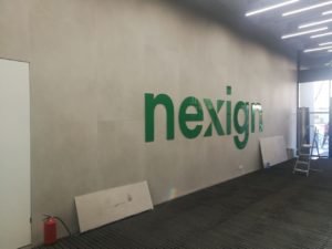 Рекламная вывеска в офисе компании Nexign под ключ